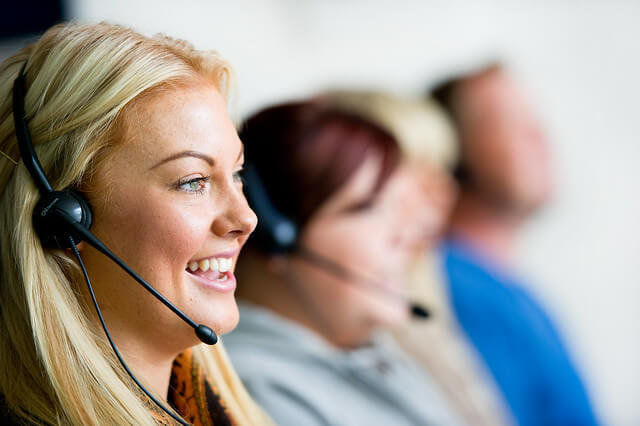 A close-up of a customer support agent on the phone. 