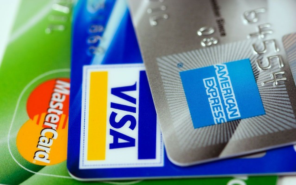 Three credit cards from Visa, Mastercard, and AMEX