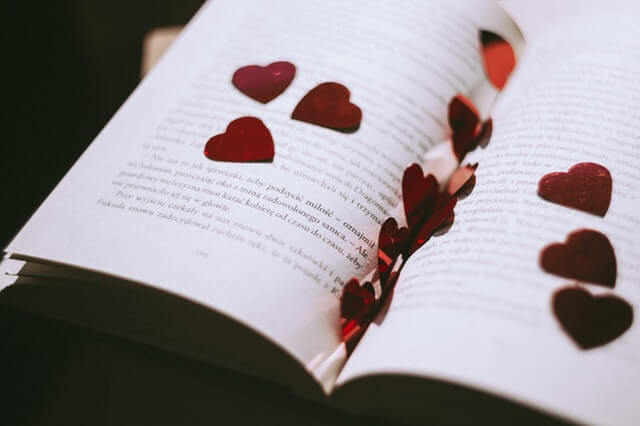 A book with love hearts cut-outs. 